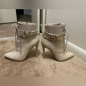 Tan high heeled booties